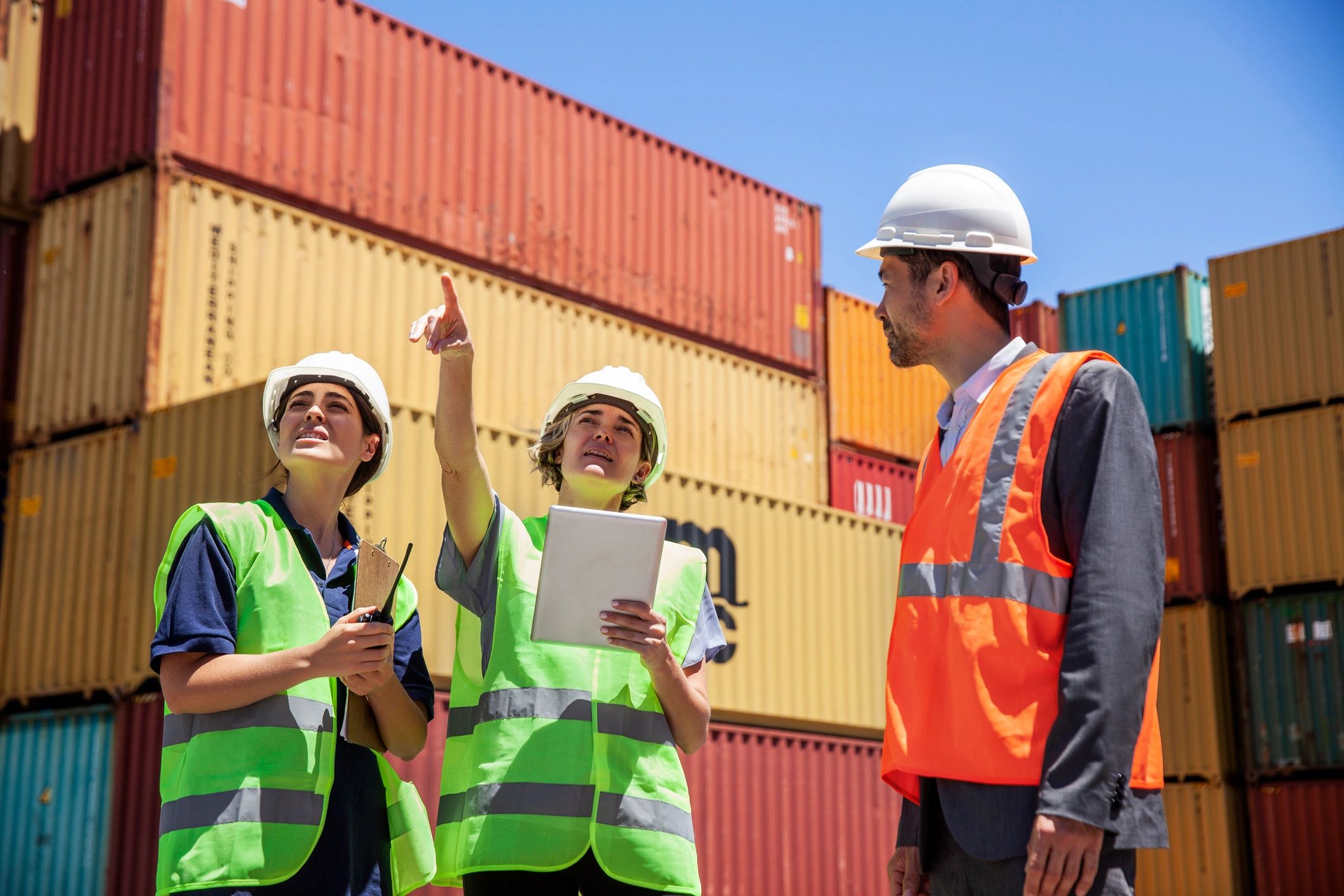 Operations staff discussing logistics work with tablet
